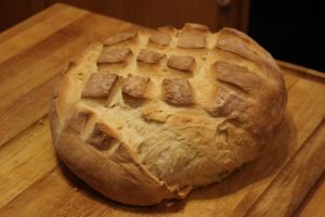 Loaf of sourdough bread on cutting board