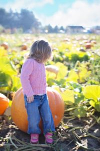 Child with giant pumpkin
