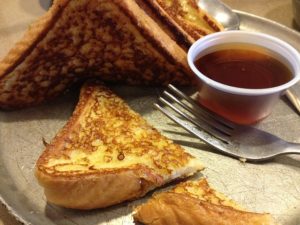 French toast with syrup on plate