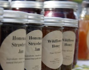 Jars of homemade jam and honey