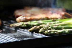 Asparagus spears cooking on grill