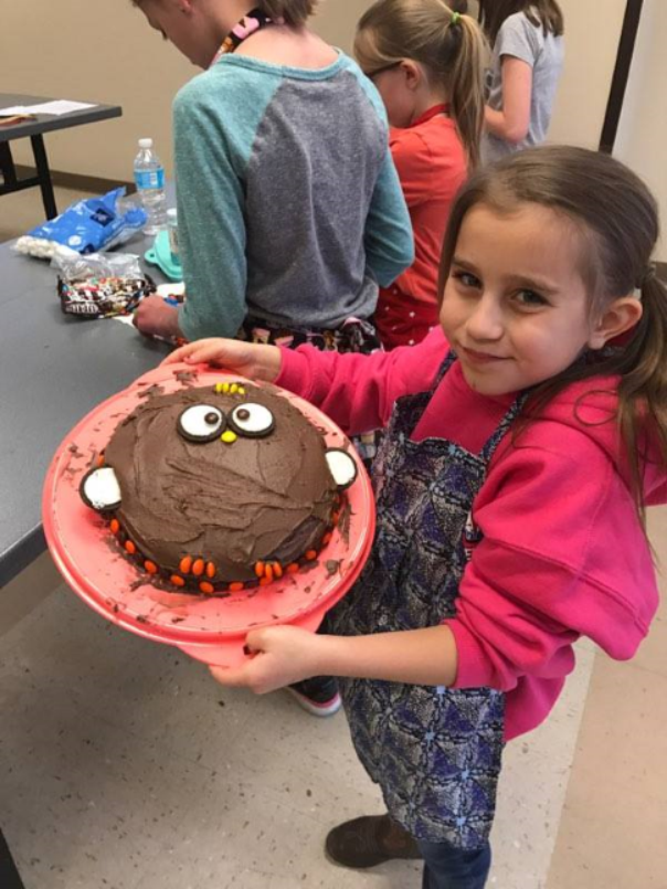 girl with a decorated cake