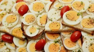 hard boiled eggs and grape tomatoes on bread