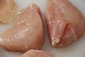 Multiple raw chicken breasts