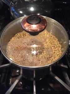lentils and liquid cooking in a pan