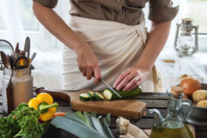 women cutting vegetables