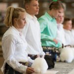 Youth participating in a rabbit show
