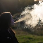 girl vaping with smoke