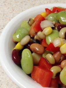 Bean salad with lima, pinto, kidney beans and blacked eye peas, corn, onions and tomatoes
