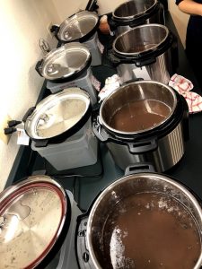 Four electric pressure cookers set up to test cooking beans