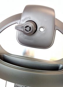 Venting and sealing valve on an electric pressure cooker