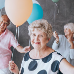 Older adults celebrating with balloons