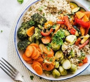 plate full of whole grains and vegetables