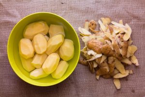 potatoes peeled with peels to the side