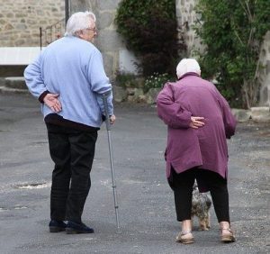 Elderly man showing empathy for an elderly woman