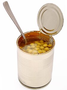 can of peas, opened with spoon inside