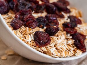 bowl of oats topped with dried cranberries