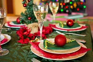 Holiday table set with alcohol in wine glasses
