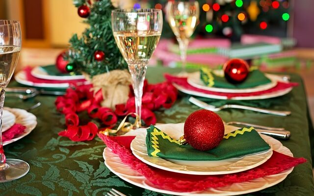 Holiday table set with wine in wine glasses