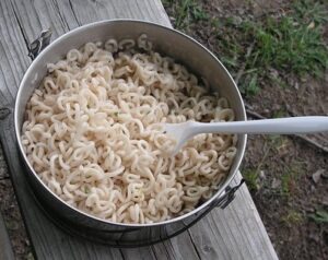Pan of rehydrated noodle's in the outdoors