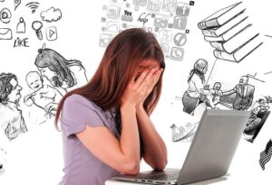 Woman expressing stress by holding head in hands and surrounded by pictures of stressors such as family, school work, work assignments, etc.
