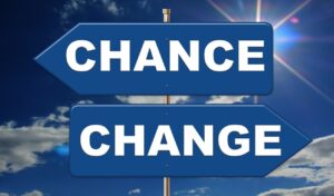 Two signs that say "change" pointing in opposite directions.