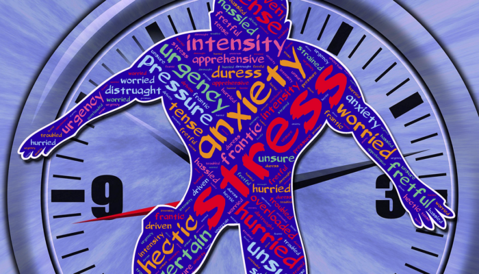 Outline of a person with the words stress , anxiety and pressure overlaid on a clock face.