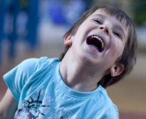 young boy laughing
