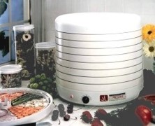 white round vertical dehydrator with a temperature control and fan