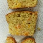 3 slices of quick breads demonstrating leavening. The bottom one shows a dent going down towards the bottom of the slice meaning incorrect leavening. The middle slice shows some adjustments in leavening. The top slice shows correct leavening.