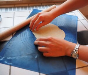 rolling out the empanada dough