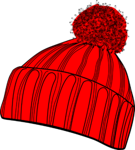 Red knit winter hat with a pom pom on top.