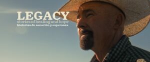 Gentleman wearing a hat with the words Legacy stories of healing and hope