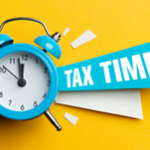 Tax Time with a blue alarm clock