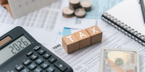 The word TAX on blocks on 1040 Tax form